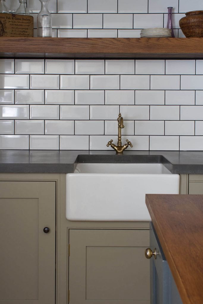 18th century manor house kitchen traditional Belfast sink, concrete worktop and metro tile splashback