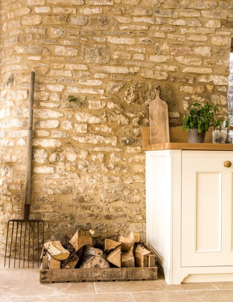 Traditional Country Kitchen with natural stone wall