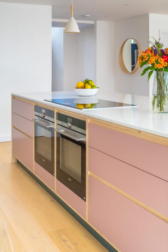 The Chapman Kitchen - exposed edge plywood kitchen in farrow and ball sulkingn room pink