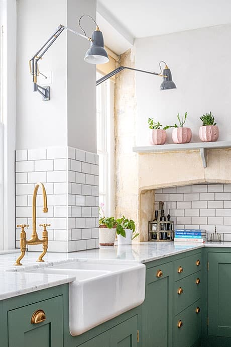 Green Shaker Kitchen with Brass Accents and anglepoise wall light