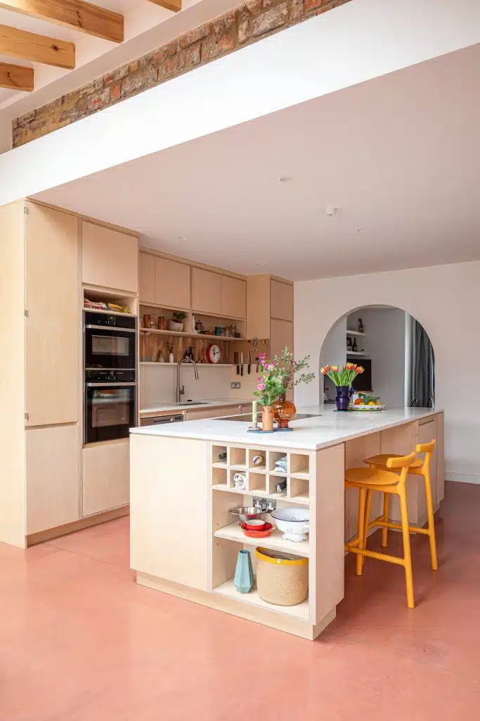 plywood kitchen with pink accents