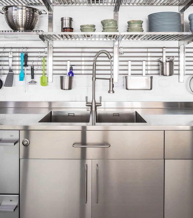 Stainless steel kitchen sink and cabinets