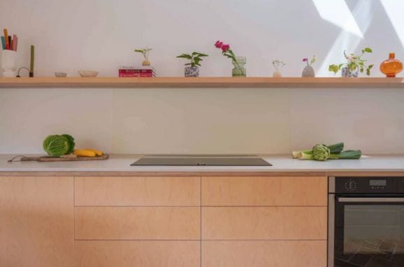 Bespoke kitchen with soft pink cabinets and marble worktop
